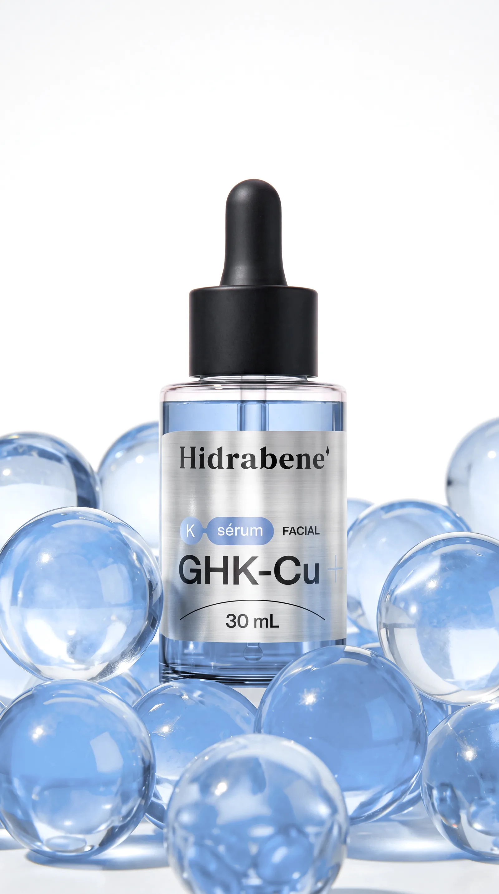 K-Sérum GHK-Cu Hidrabene entre esferas de vidro azuis